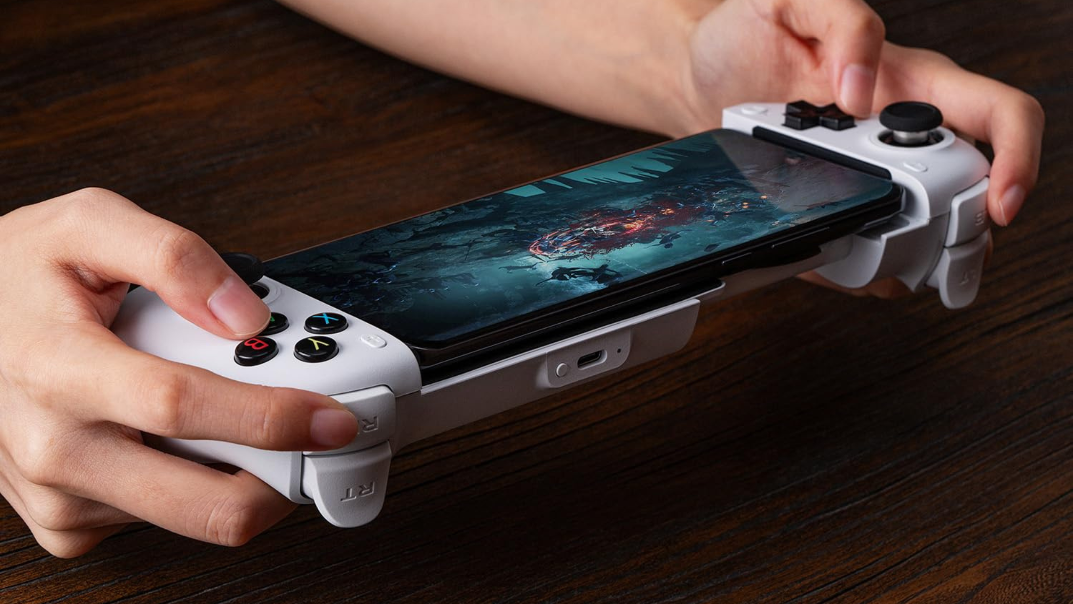 Person using 8Bitdo Ultimate Mobile Gaming Controller
