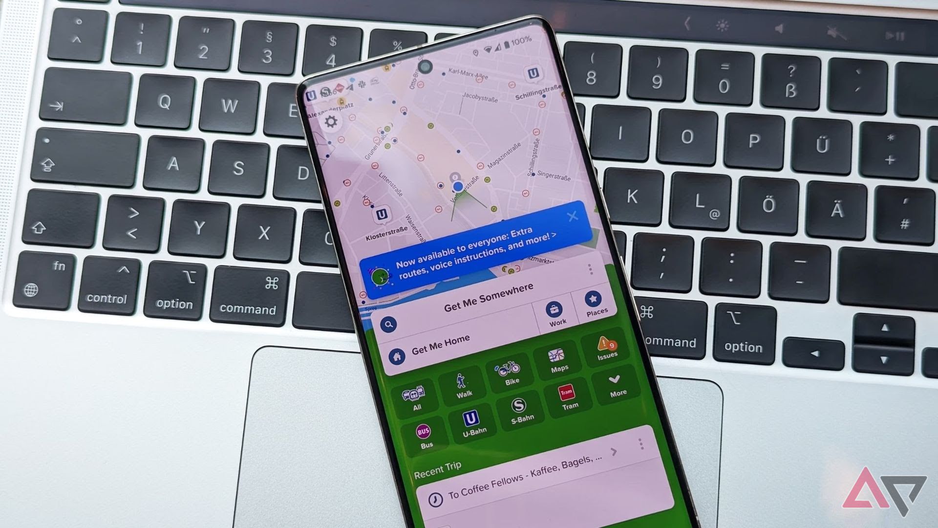 phone with citymapper app open resting on apple mac keyboard