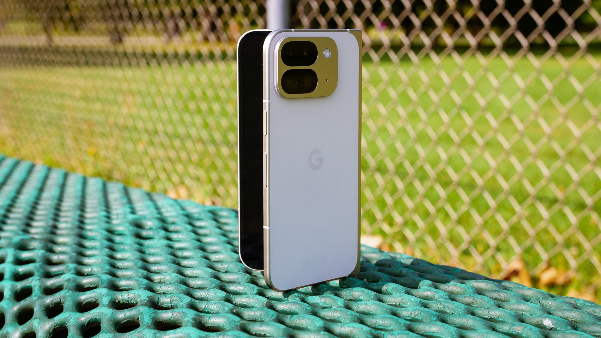 A phone on a colorful background with the Google Pixel camera app icon over the screen, overlayed by a red circle with a cross through it