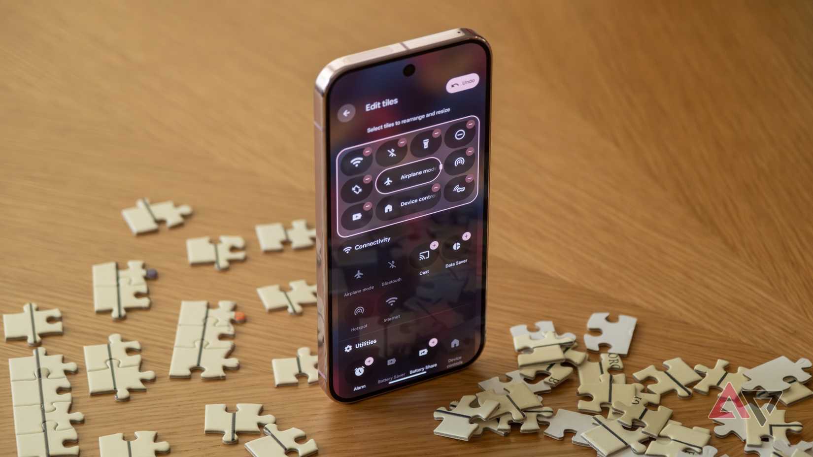 A phone showing the YouTube logo on a colorful background