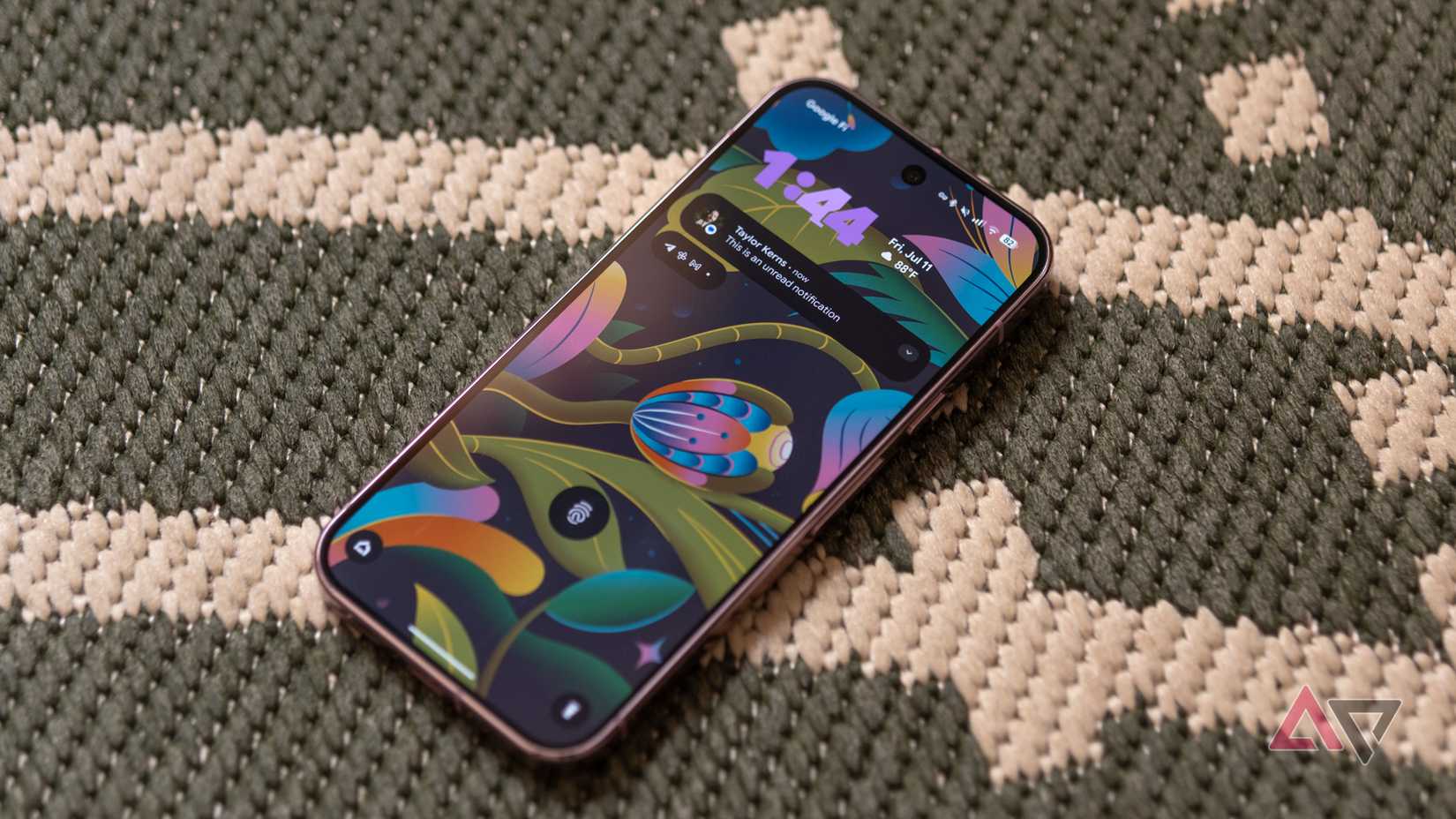 Samsung Galaxy A16 laying face down against a rock