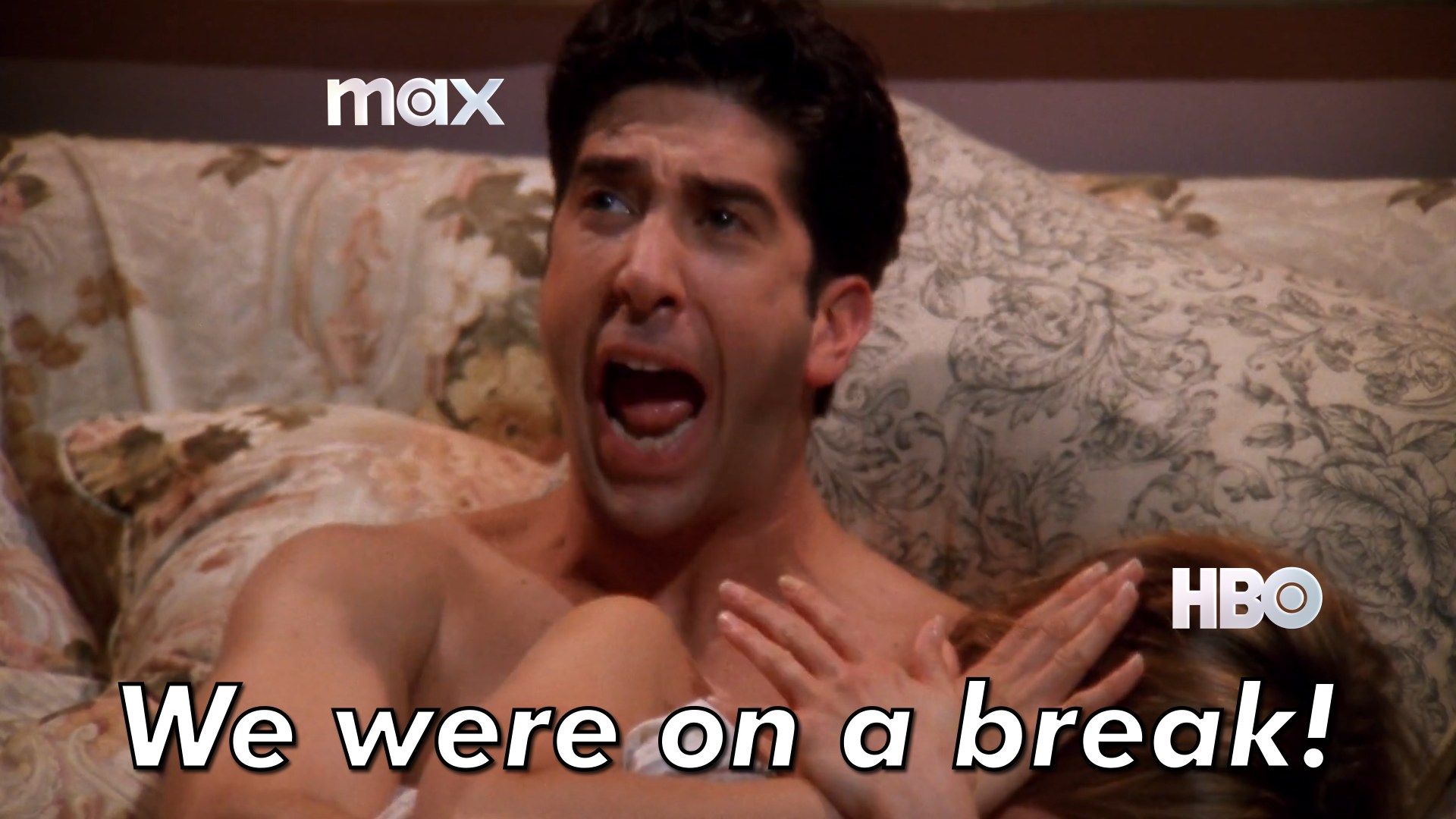 Ross from Friends labeled "Max" laying next to a woman labeled "HBO" as he screams to someone off camera, "We were on a break!"