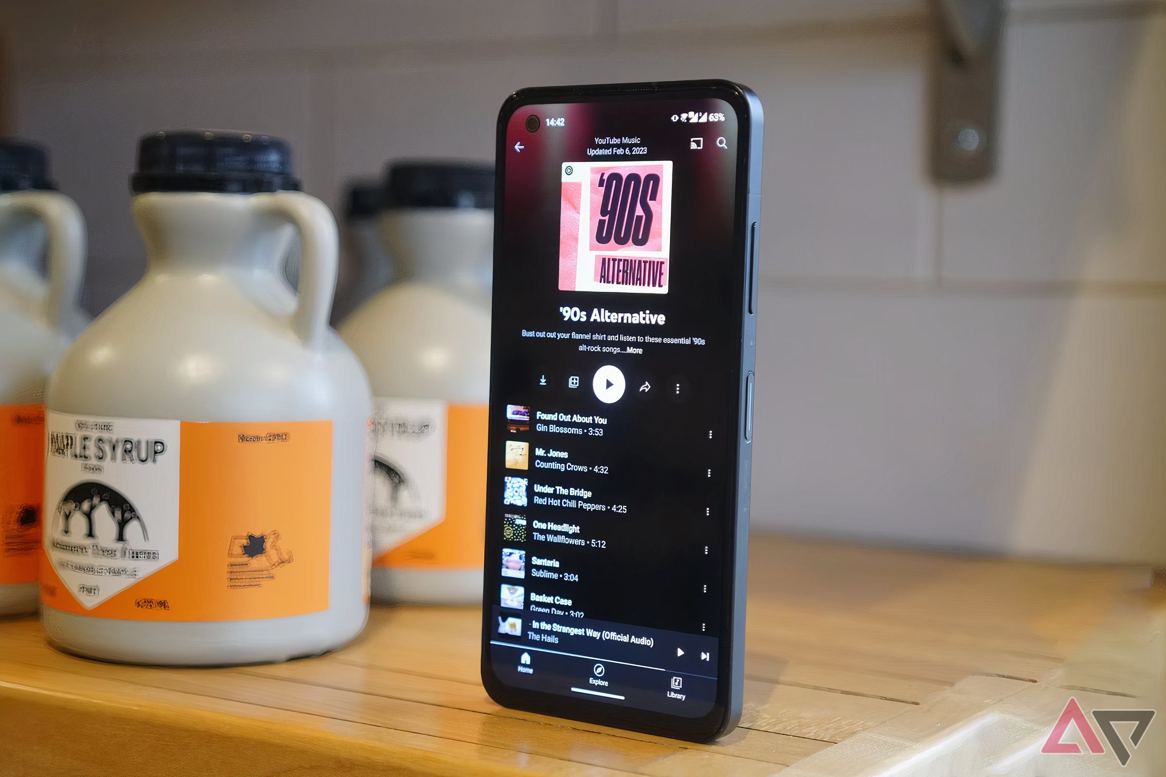 A phone's display showing a YouTube Music playlist.