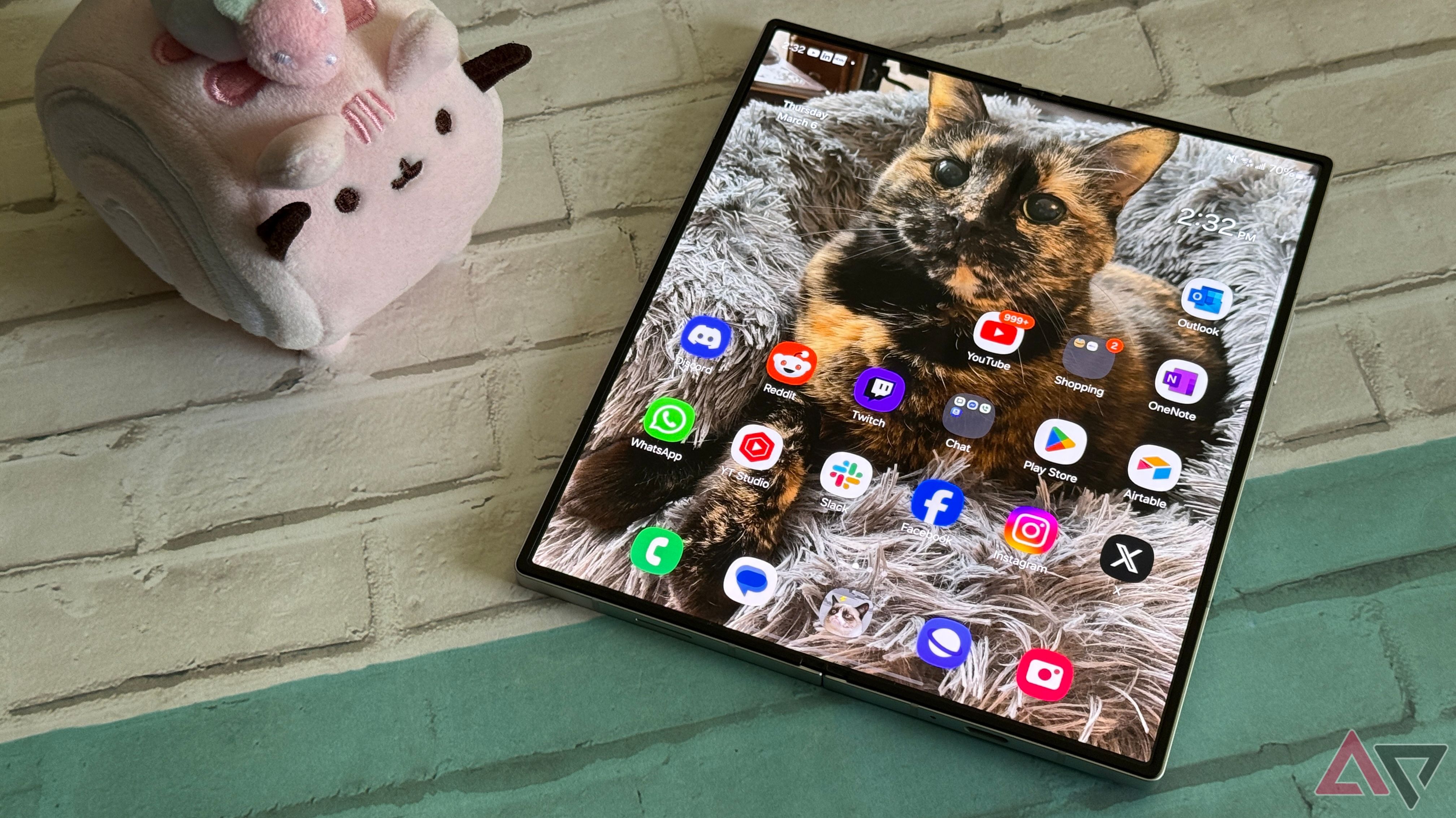 Samsung Galaxy Z Fold 6 opened with a cat on the wallpaper and Pusheen