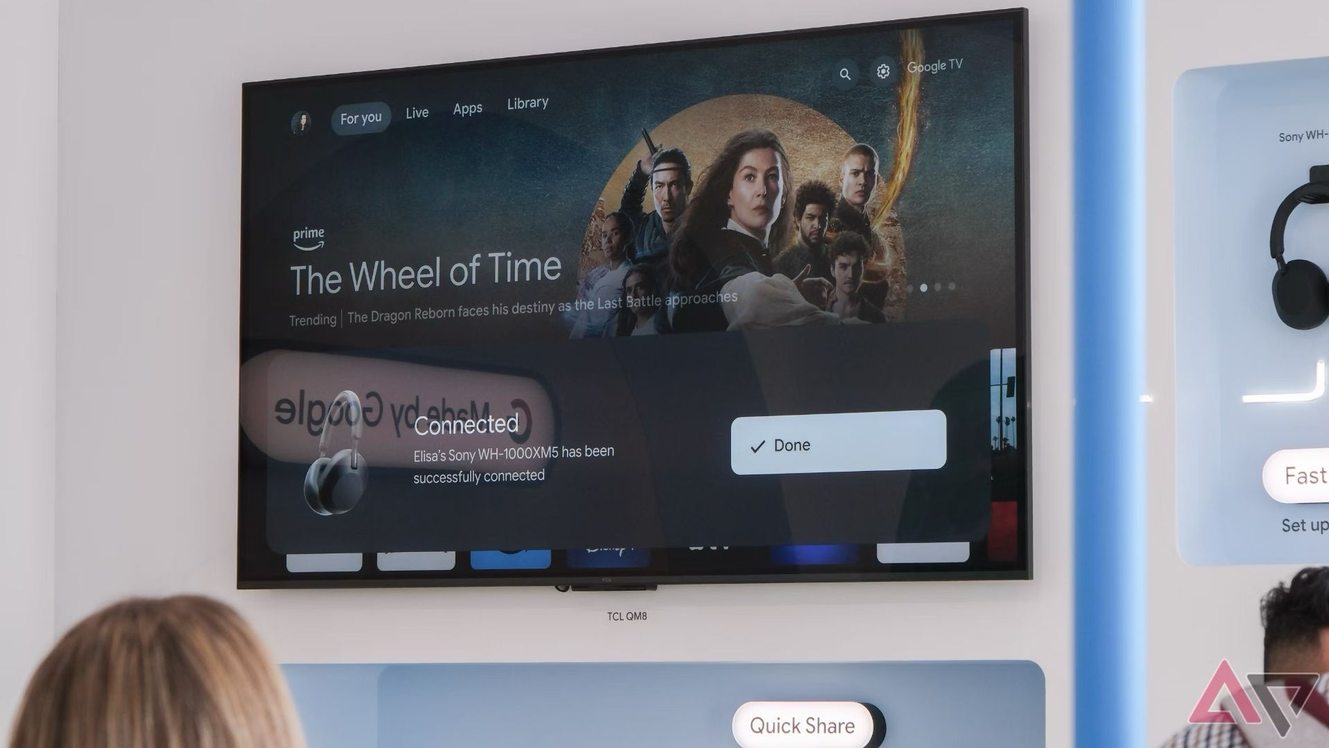 A TV handing on a wall showing a top FAST streaming service