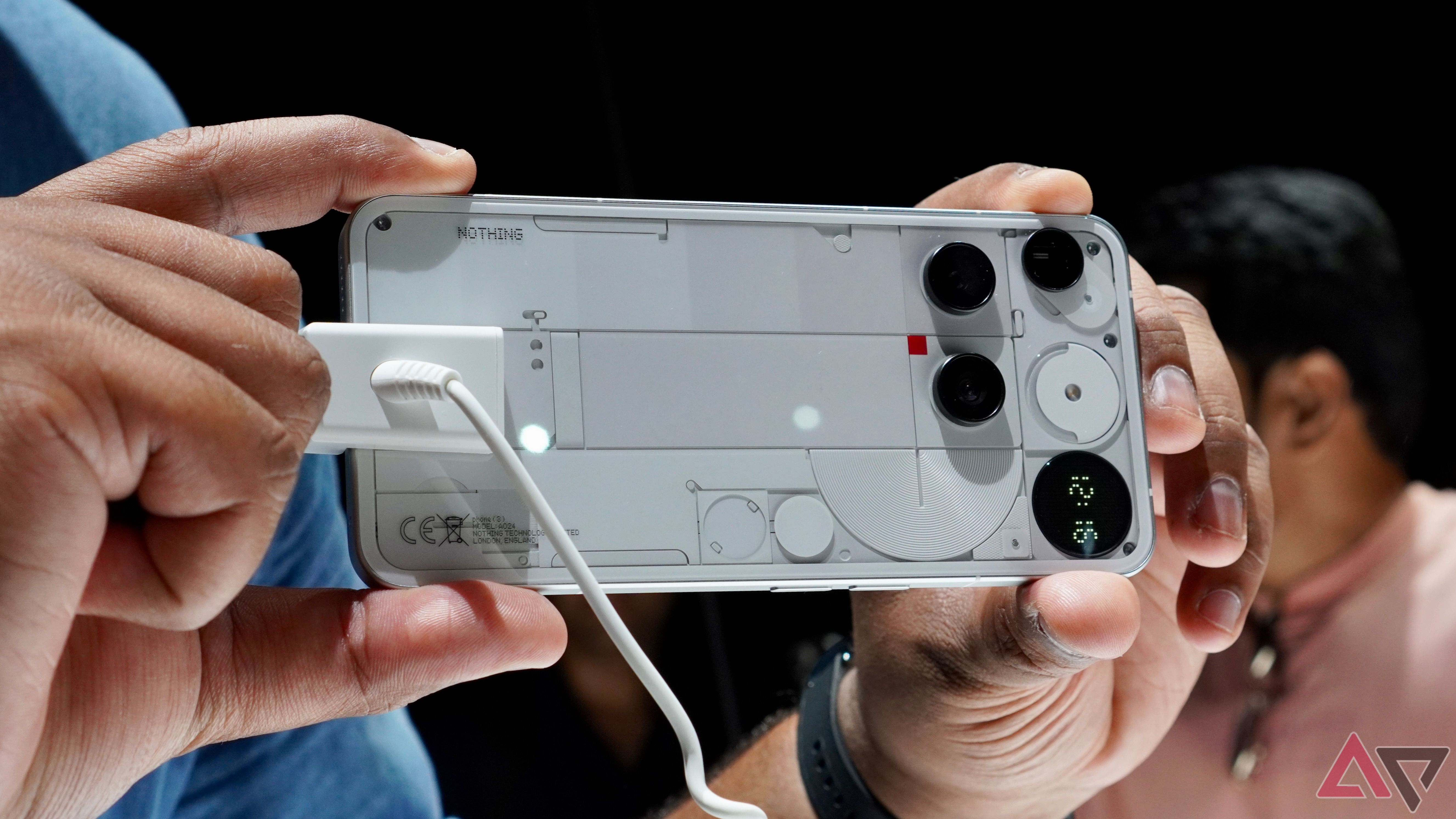 A person holding the Nothing Phone 3 and taking a photo