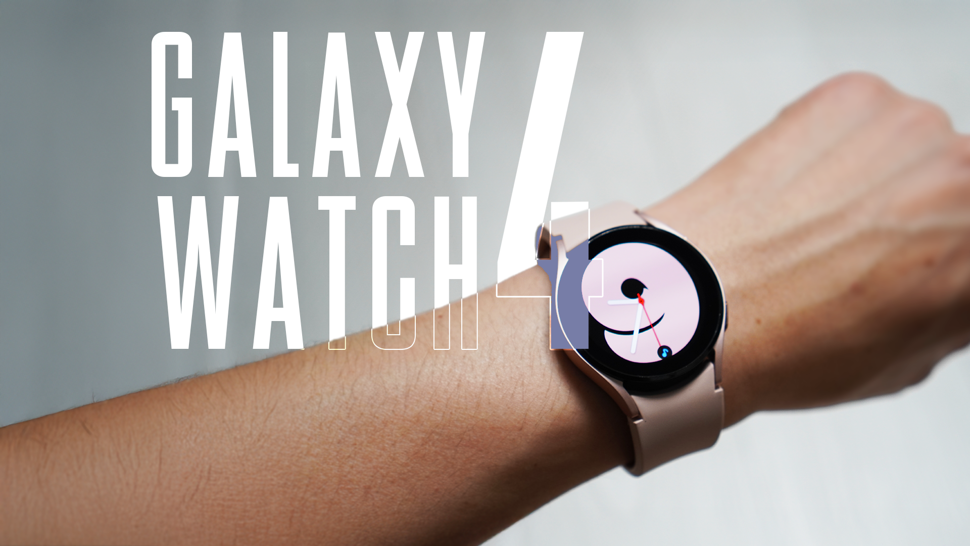 The Galaxy Watch 5 in pink strapped to a person's left wrist