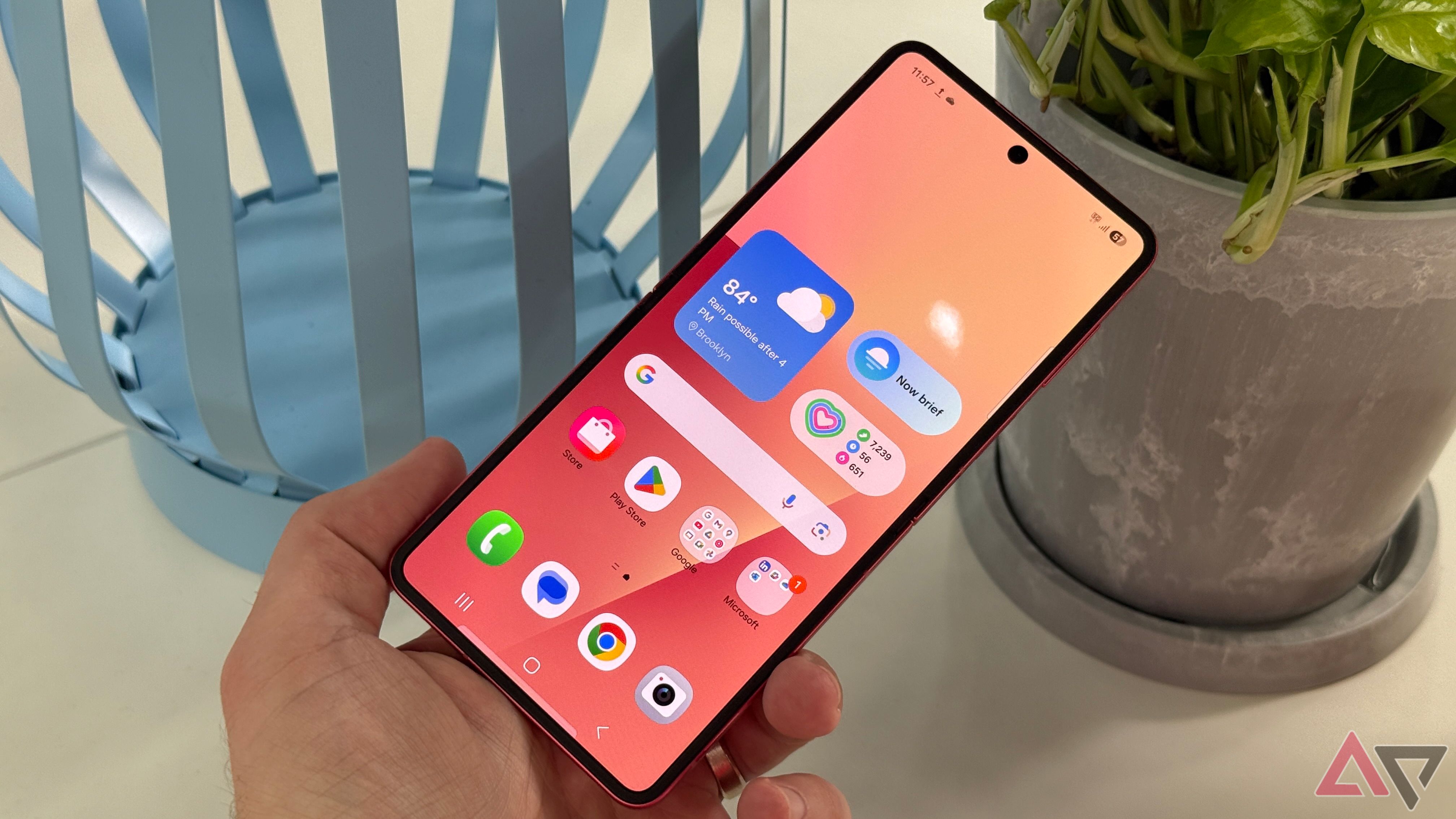 iPhone 16 Pro running iOS 18 with a custom pink theme on top