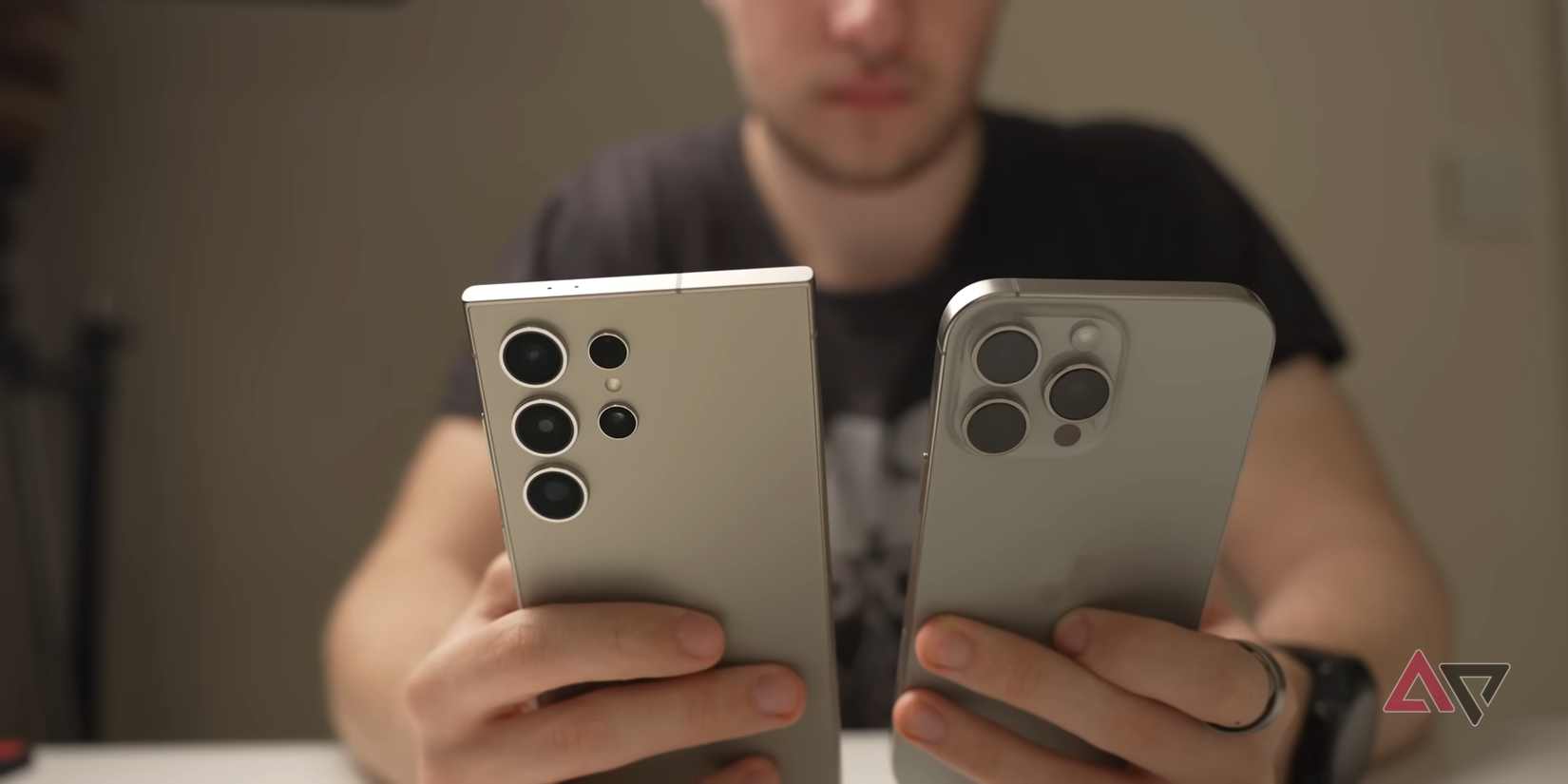 Render of two Google Pixel 10 phones with bold 'PIXEL 10' text in the background, surrounded by abstract colorful shapes