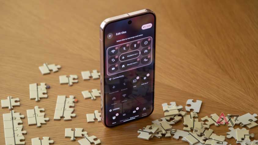 the facebook page of facebook shown on a samsung phone on the armrest of a couch