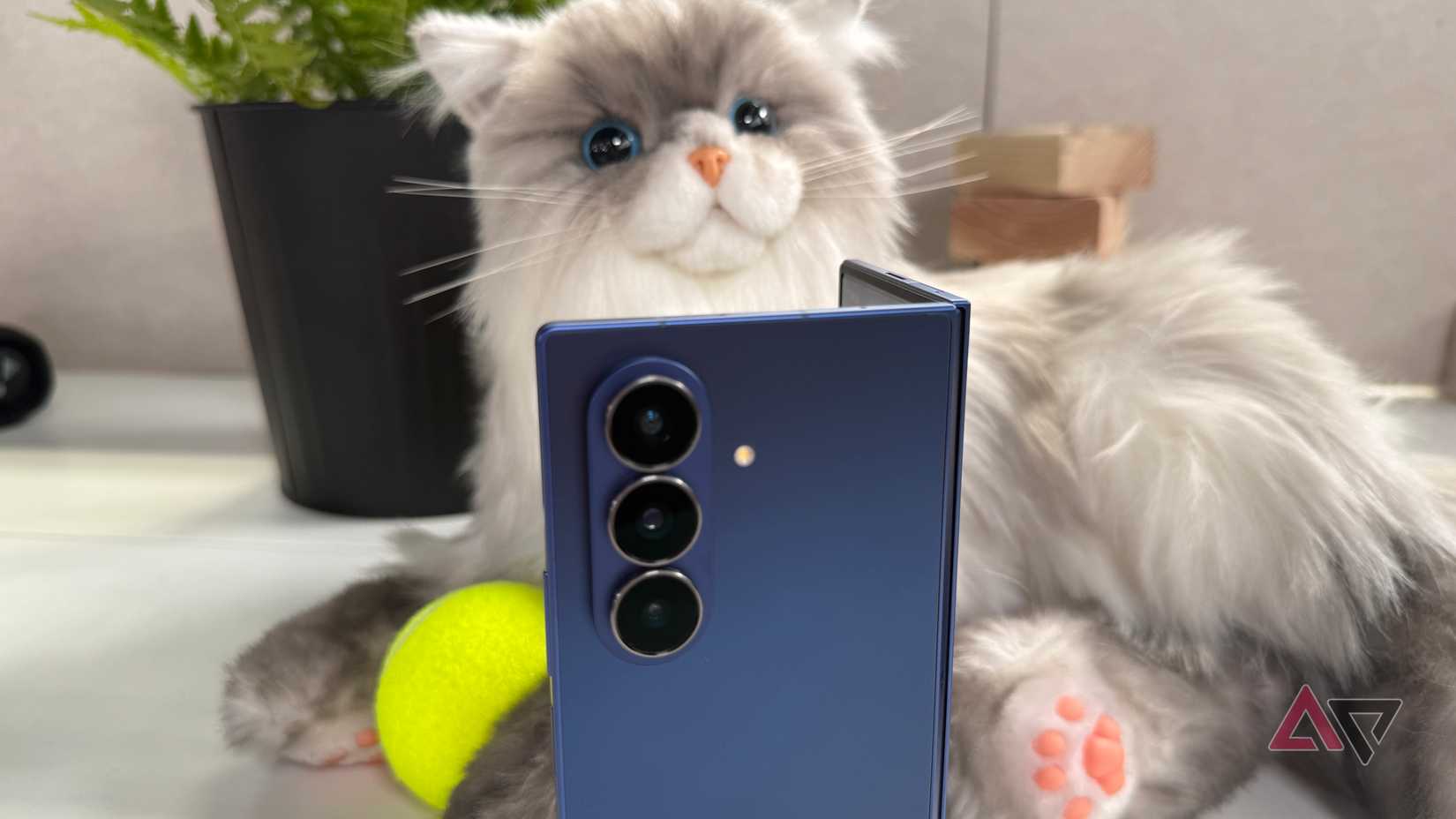A Pixel 9 Pro open to quick settings, sitting upright among puzzle pieces.