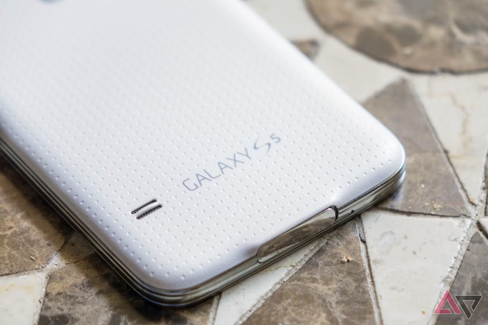 Samsung Galaxy S5 lying face down with new AP logo