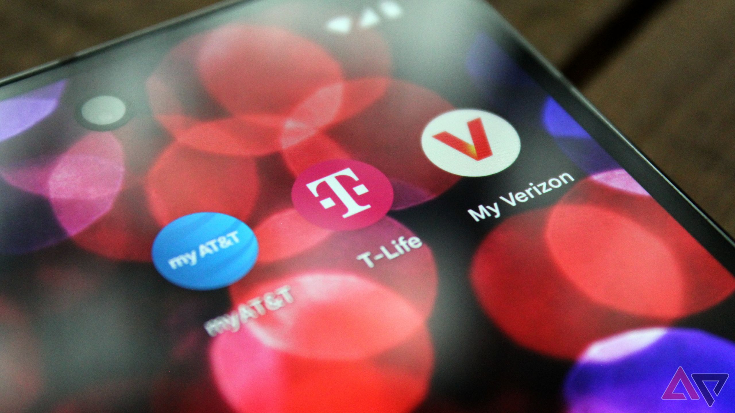AT&T, T-Mobile, and Verizon's carrier apps shown on an Android phone's home screen.