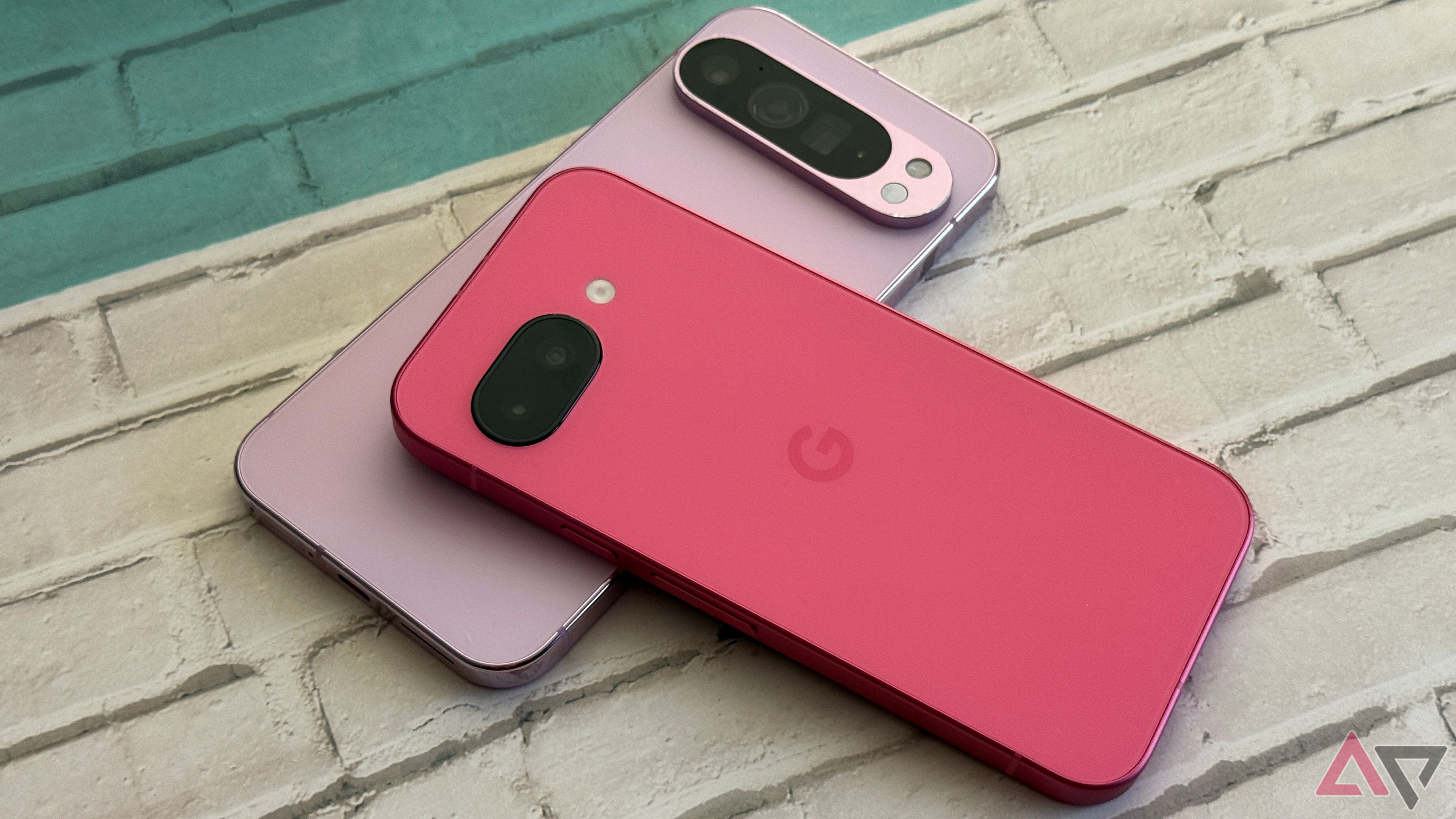 Google Pixel 9a laying on top of a Google Pixel 9 Pro XL