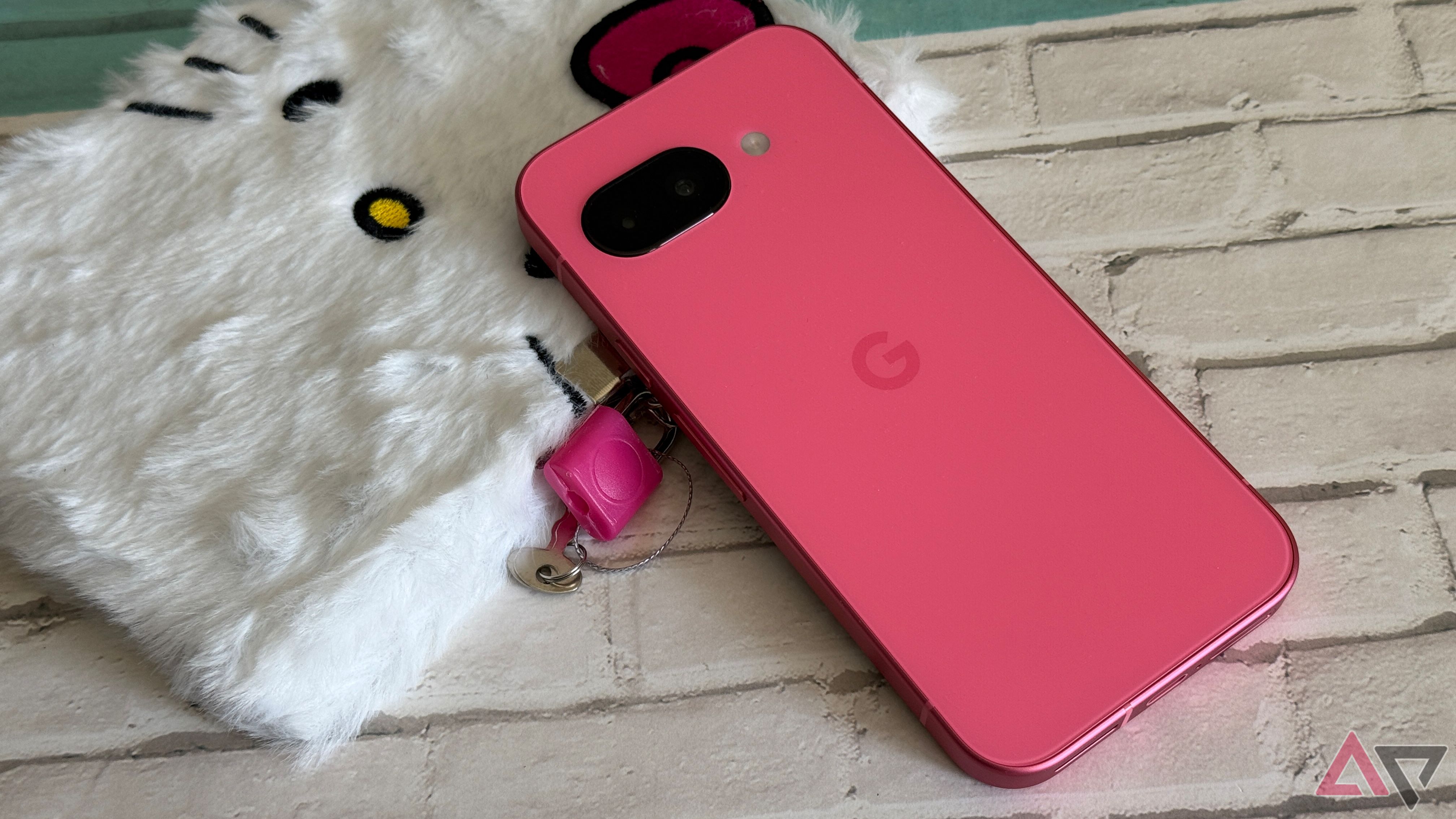 Google Pixel 9a sitting on a Hello Kitty diary