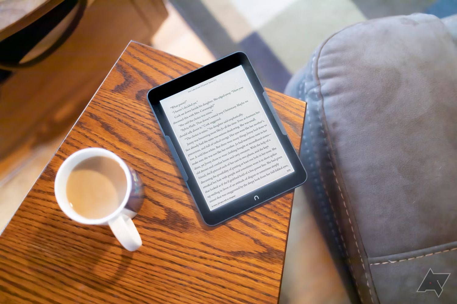 Nook Glowlight 4 Plus laying face up on edge of table with screen on