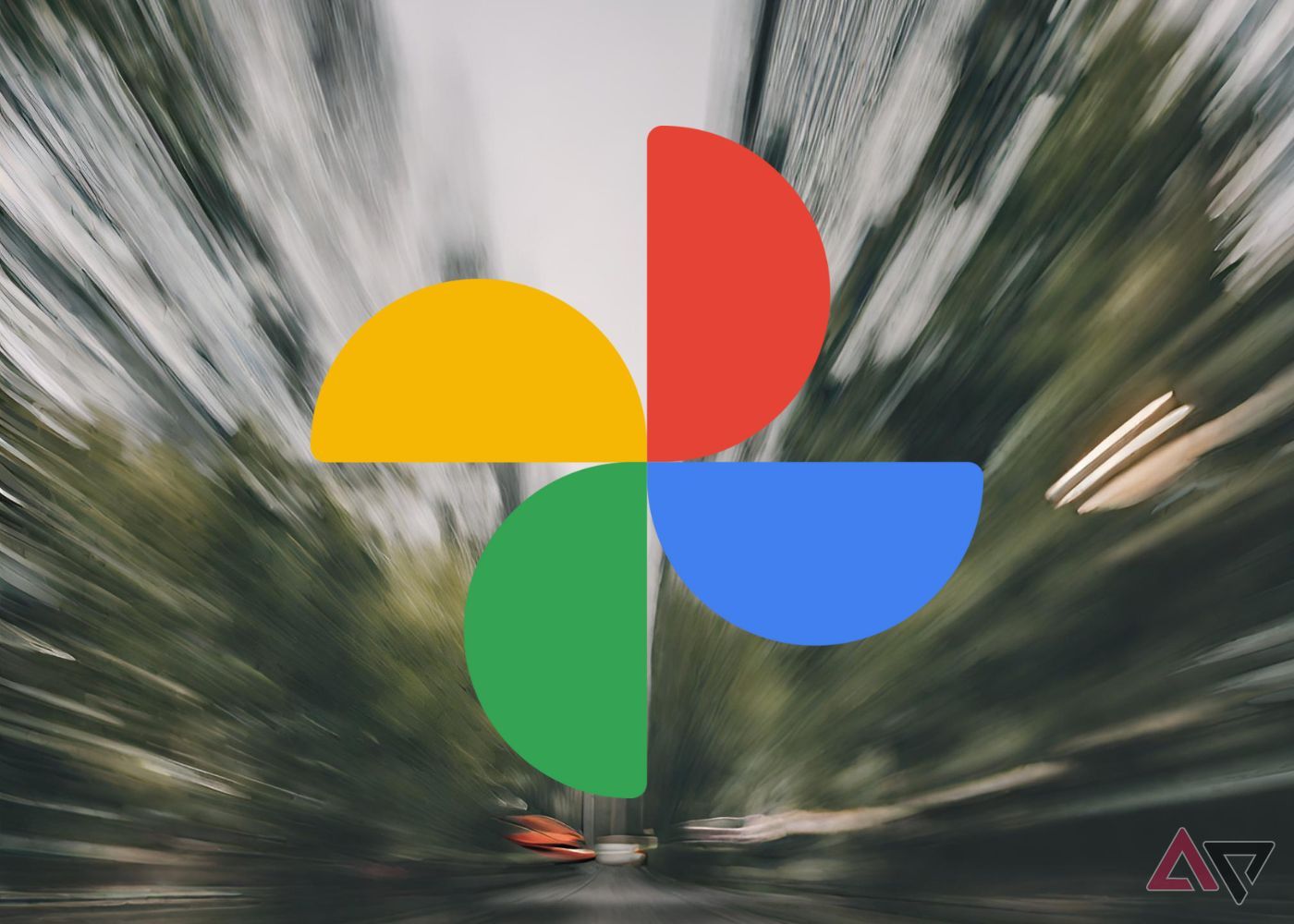 image of Google photos logo overlaid on an image of blurred trees