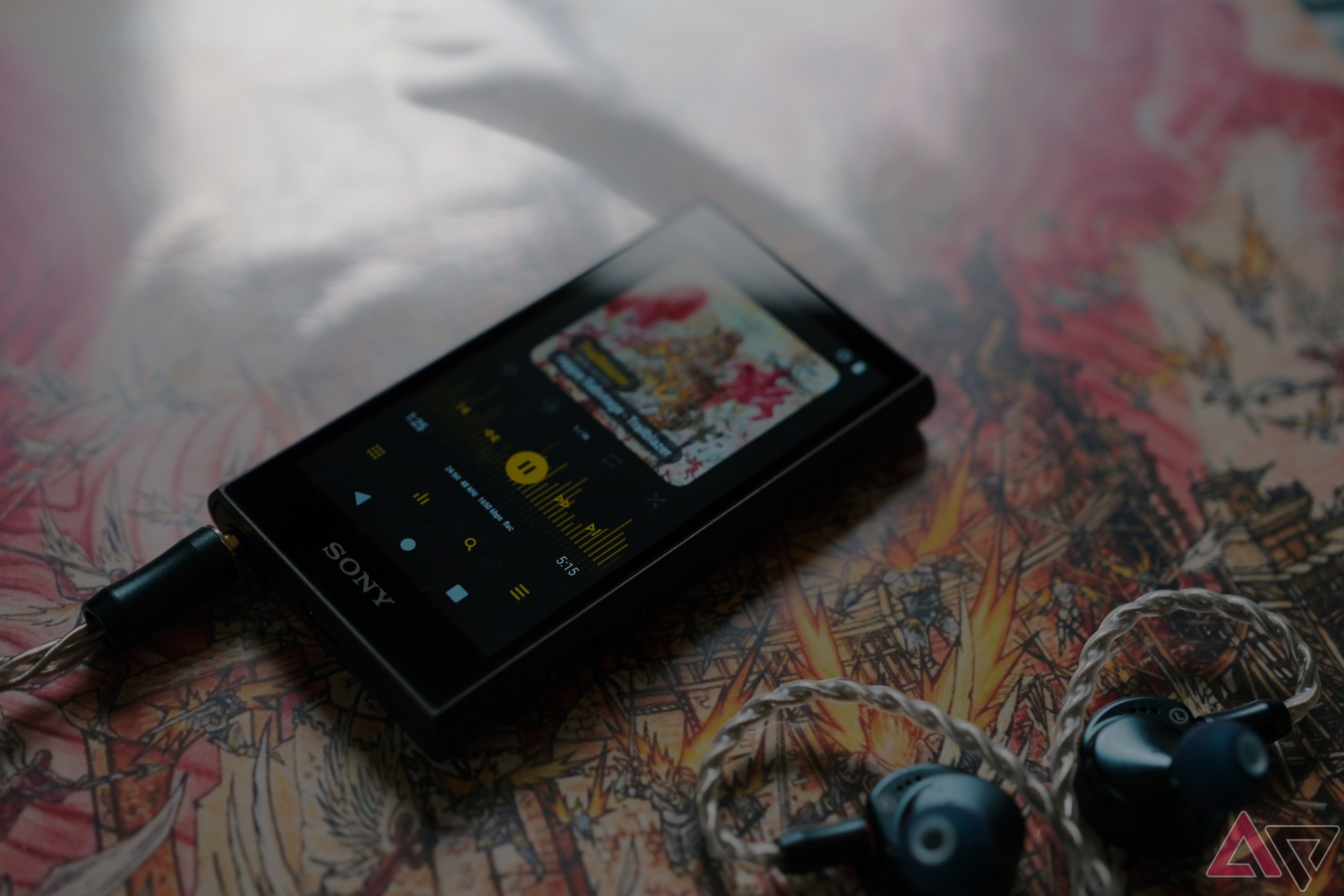Sony NW-A306 Walkman laying on album cover close up